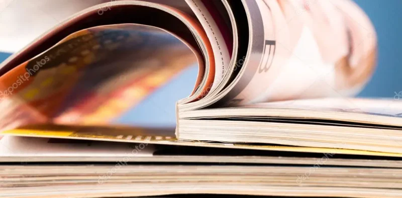 depositphotos_90347818-stock-photo-books-on-wooden-deck-tabletop